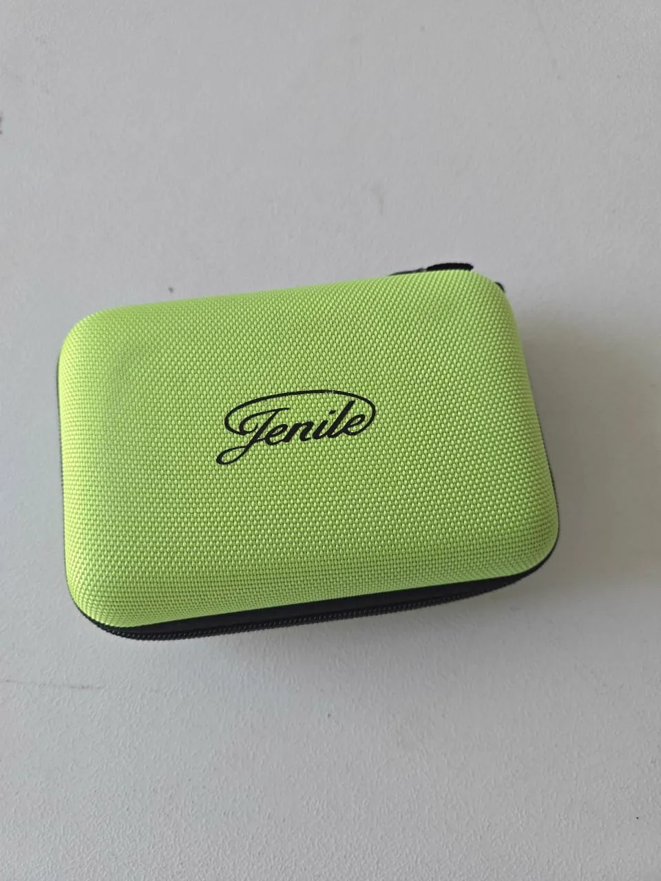 The green Jenile travel case, zipped shut